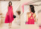 Sleeveless pleated silk halter dress with ring-back detail and flowy midi silhouette